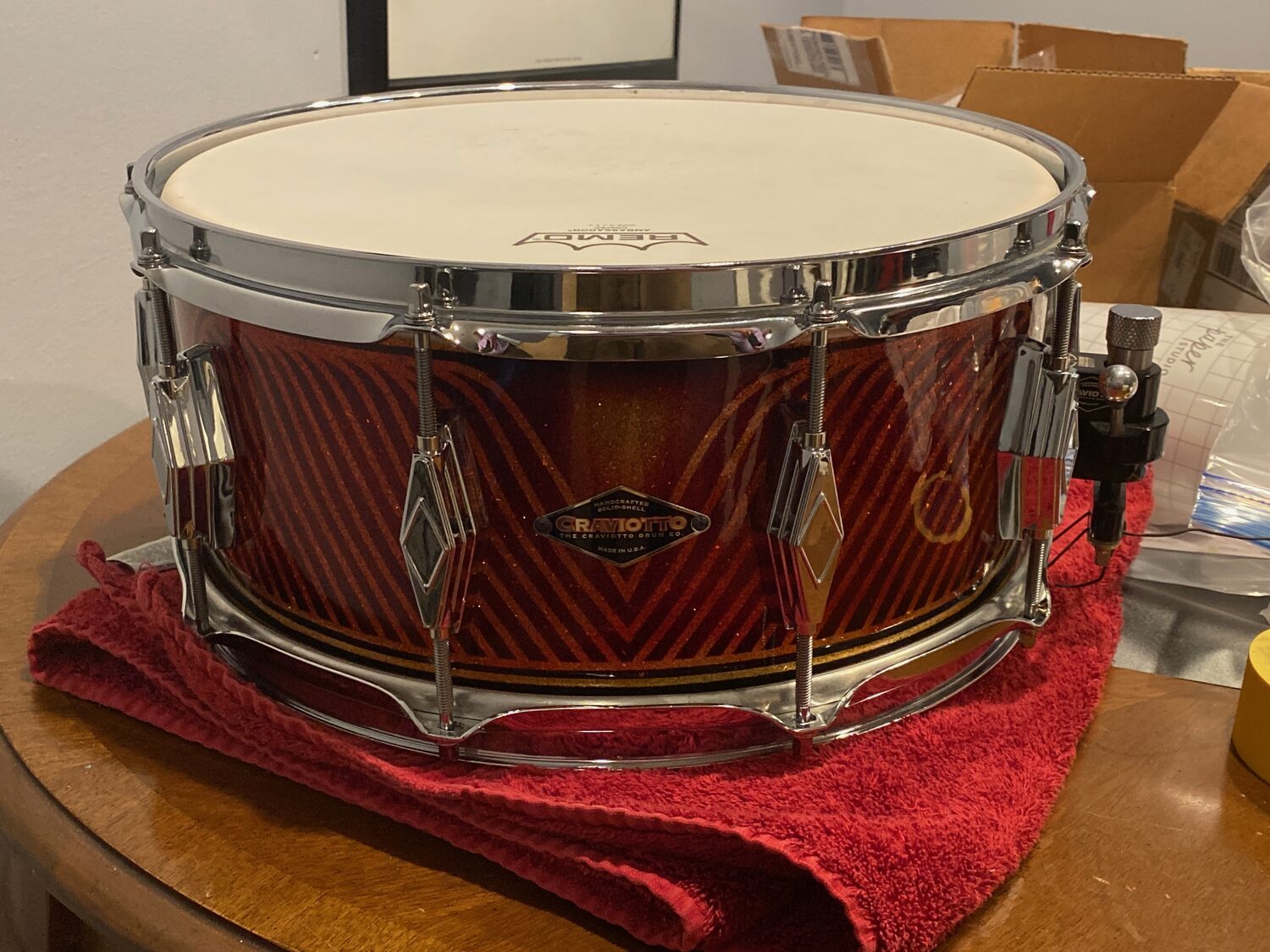 Craviotto maple snare with green-and-orange pinstripe linework